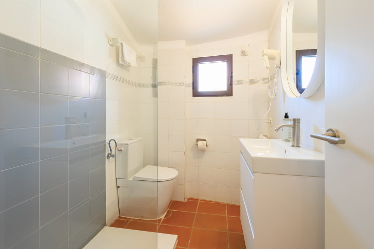 Bathroom with shower tray and hairdryer