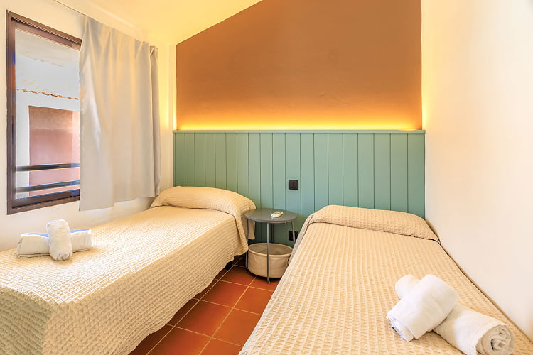 Room with two single beds